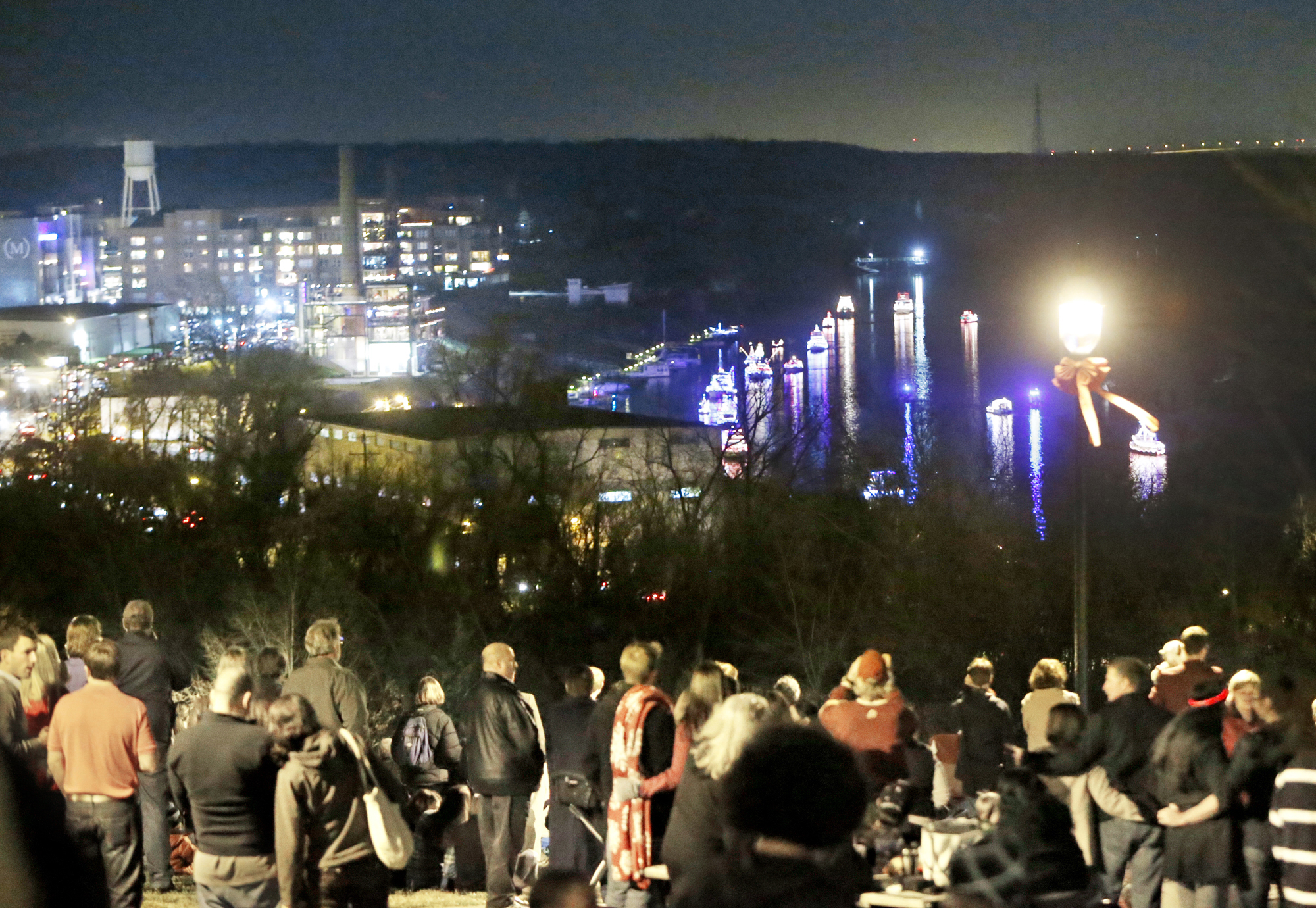 People view the Parade of Lights on the James River from Libby Hill Park Photo Credit