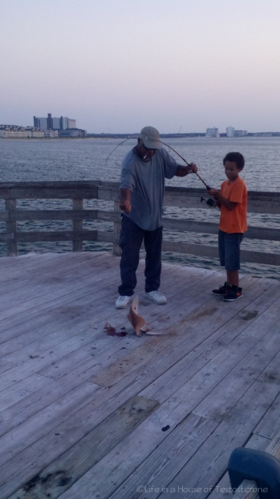 Dad Helping Tre Pull In His Catch