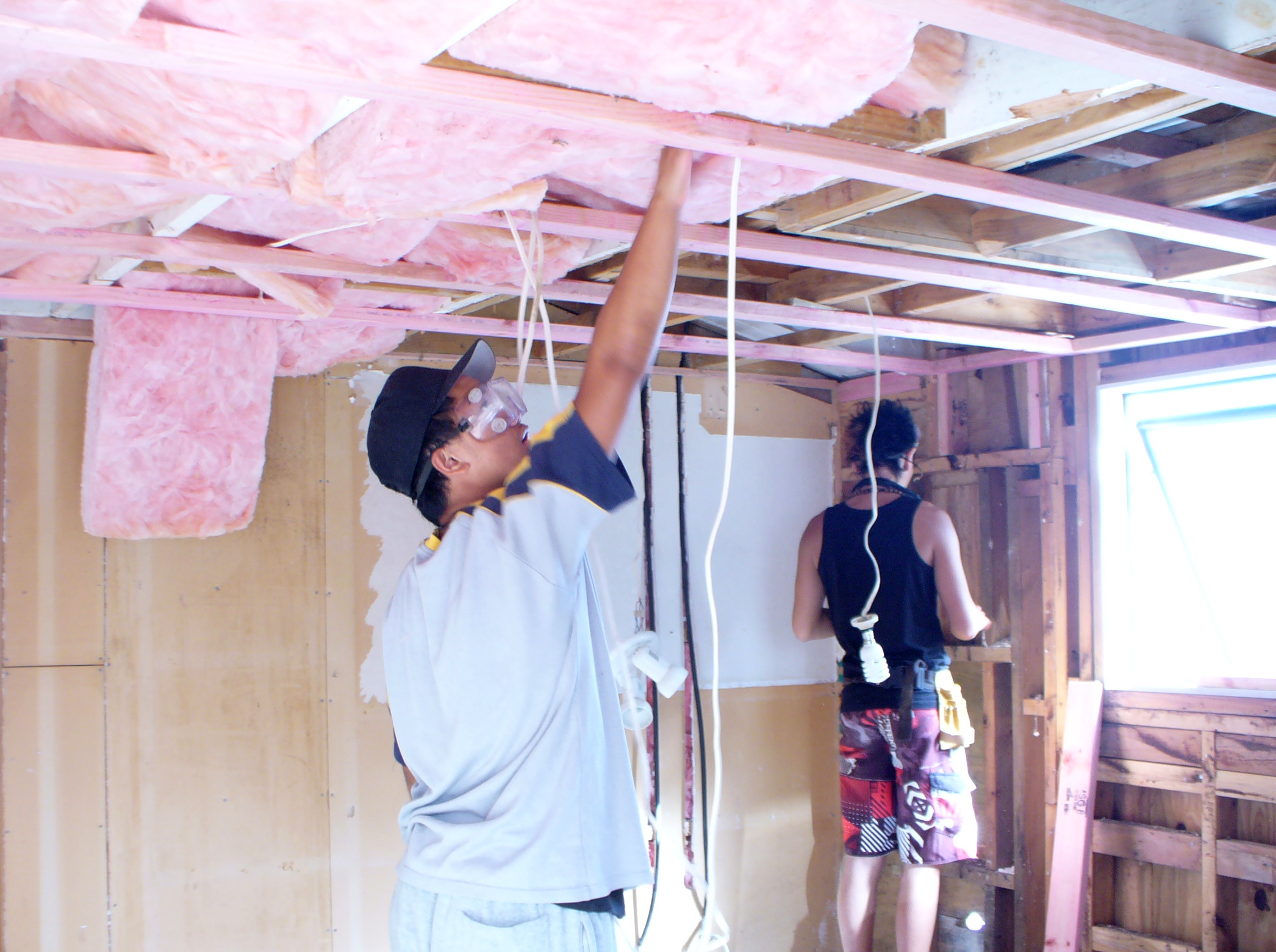 workers installing insulation