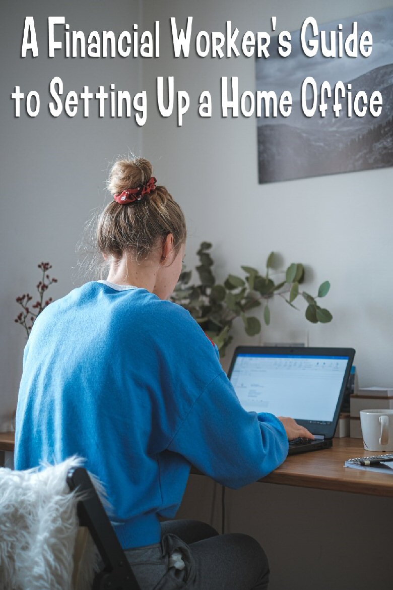 woman in blue sweater sitting in front of laptop computer