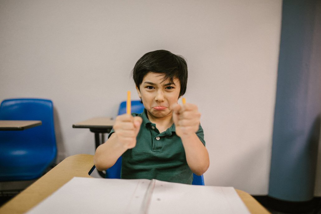 angry boy, snapped pencil, school