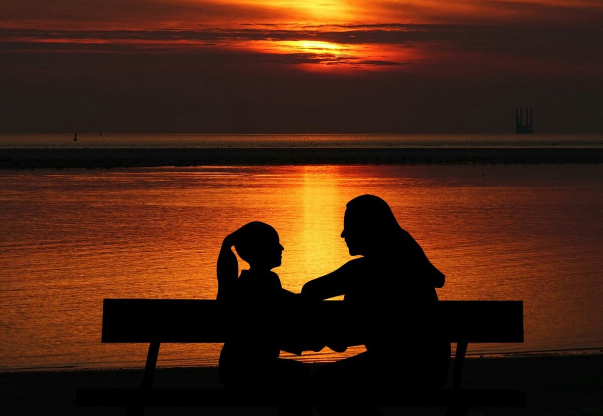 child and parent, sunset