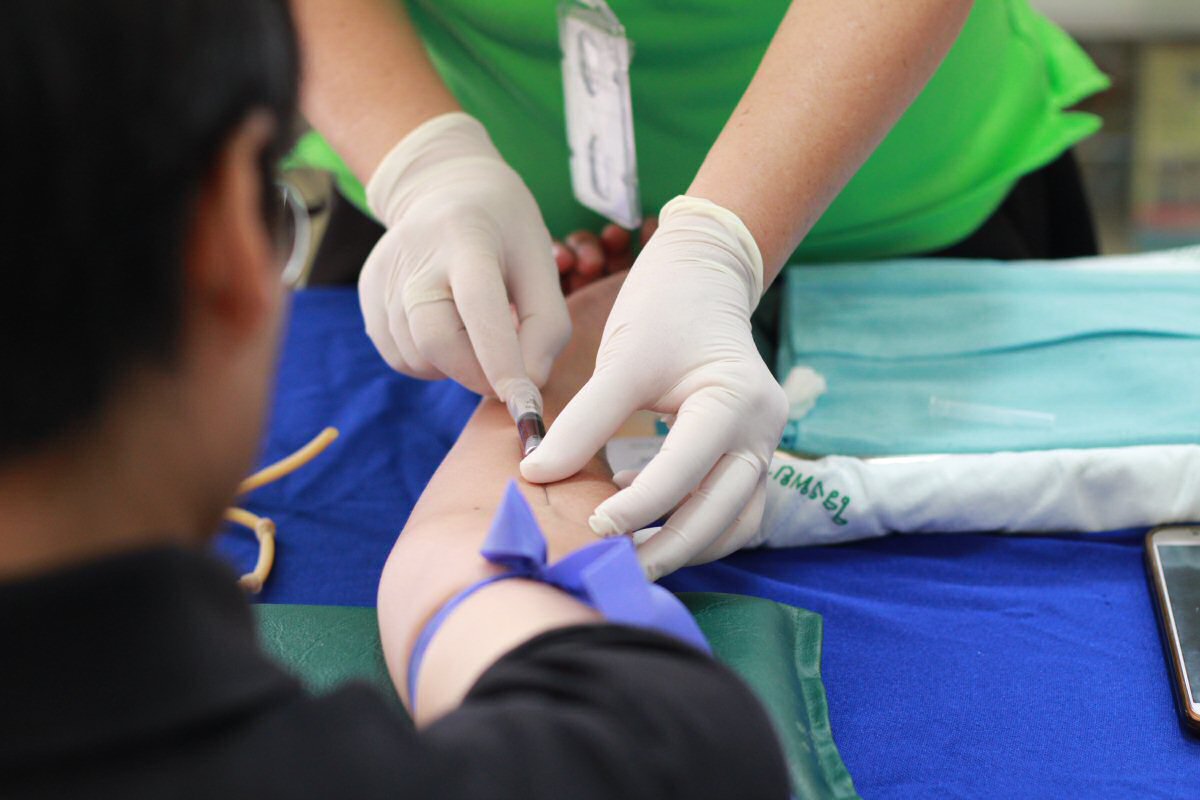 nurse taking blood sample