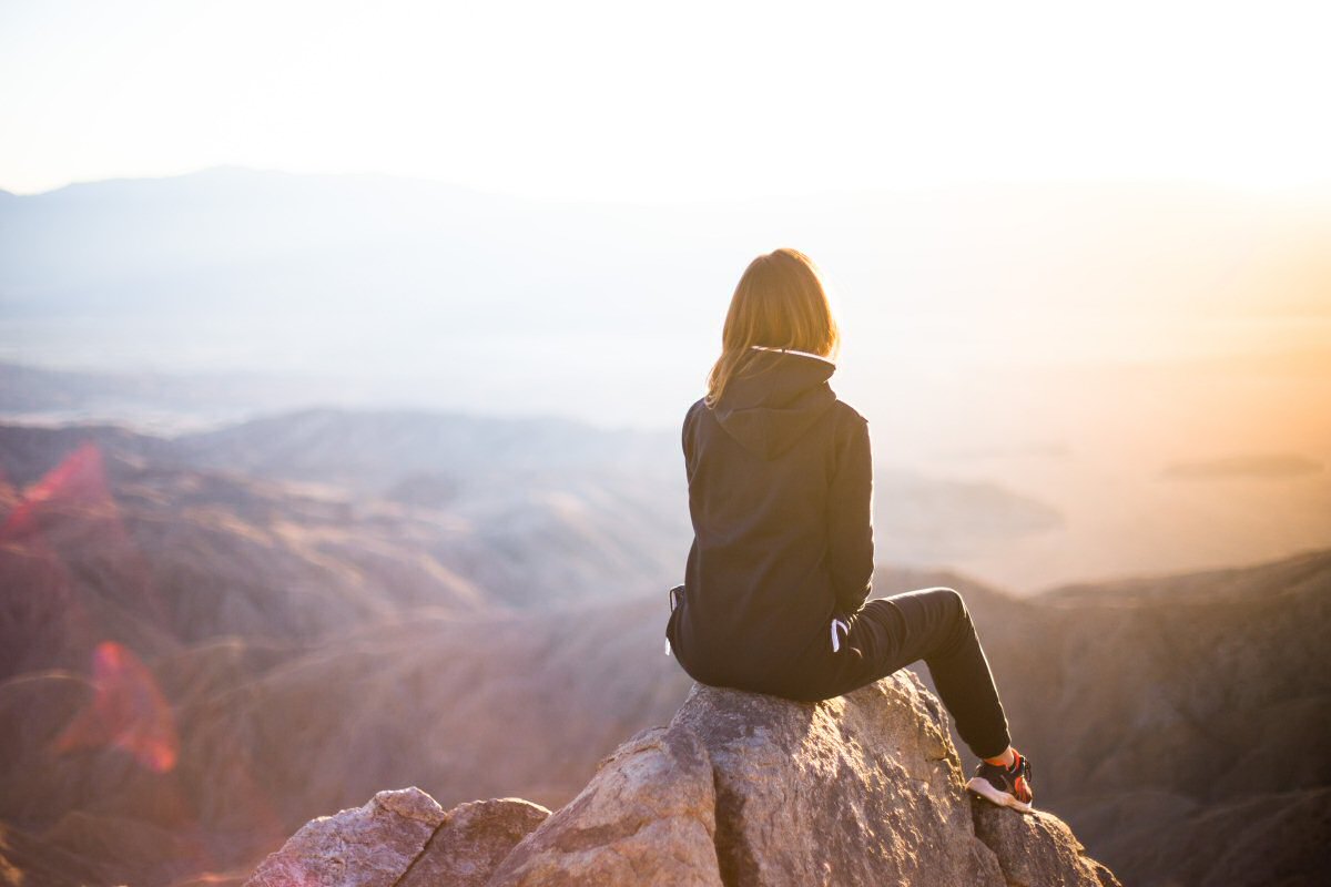 woman looking out over mountain