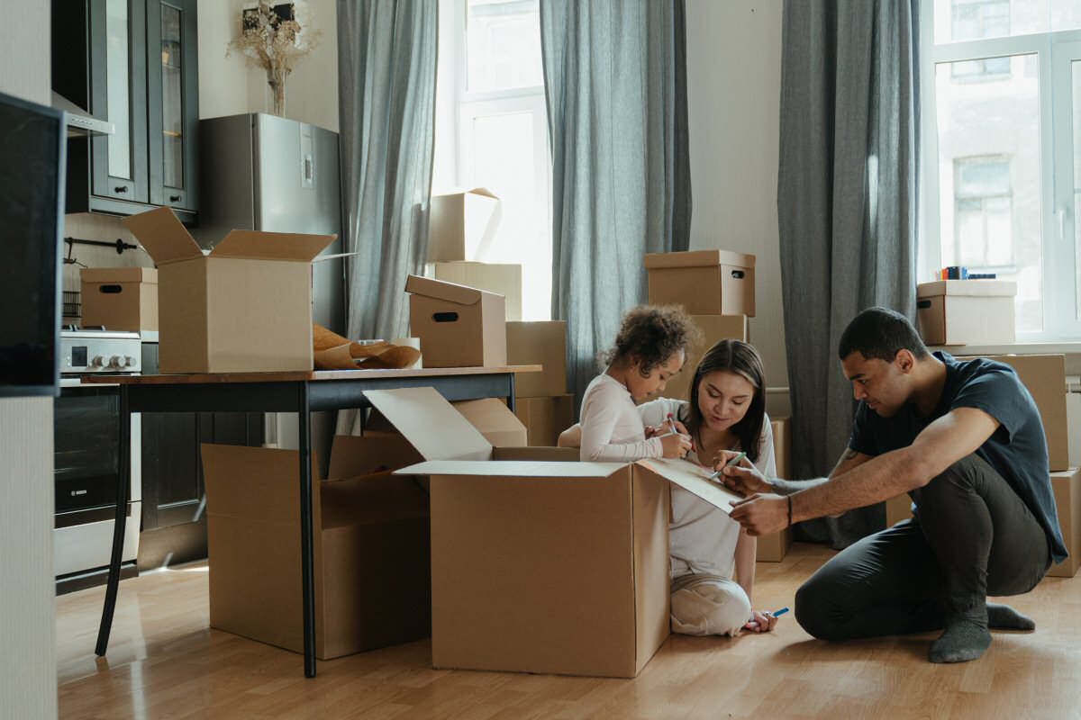 family moving with boxes