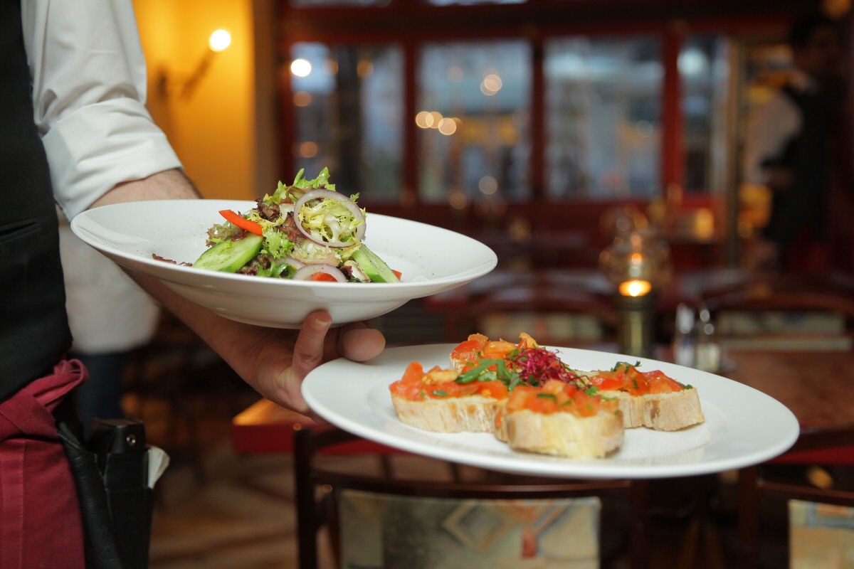 restaurant cook serving food